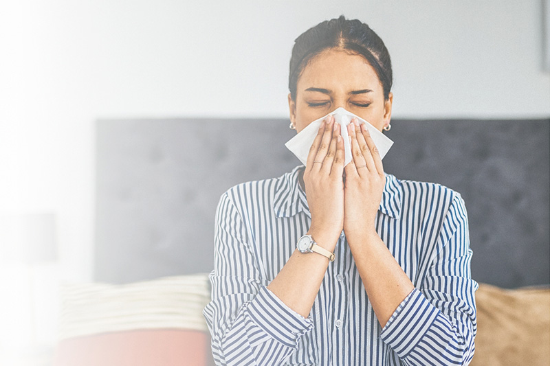 Woman Sneezing